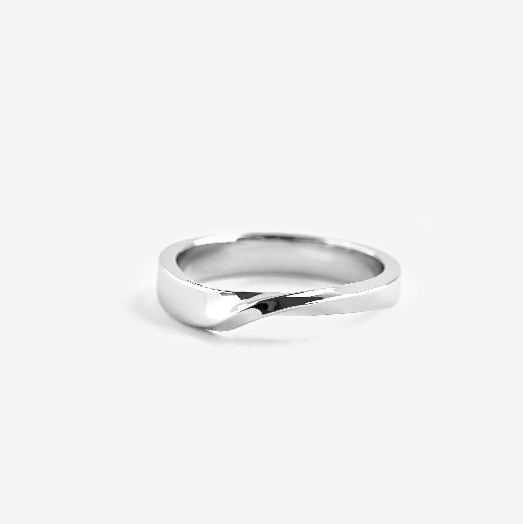 Amor Ring in sterling silver with a twisted precision edge design, clean-line and timeless style.