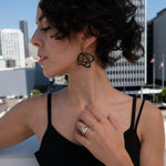 side profile of Gemino earrings in black nylon