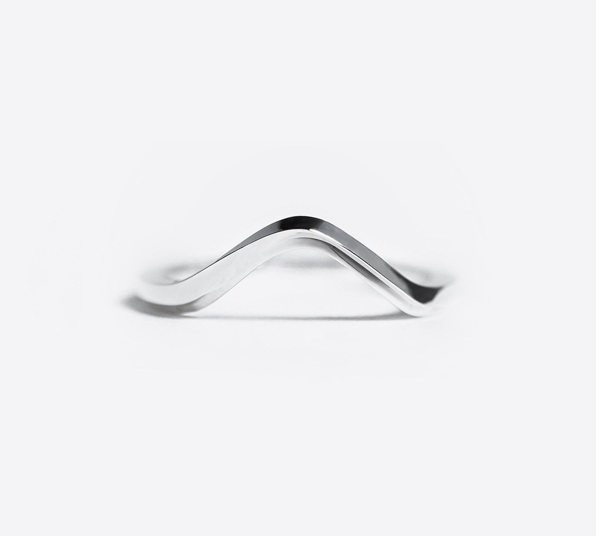 Minimalist silver Hera Ring with a symmetrical V-shaped design on white background