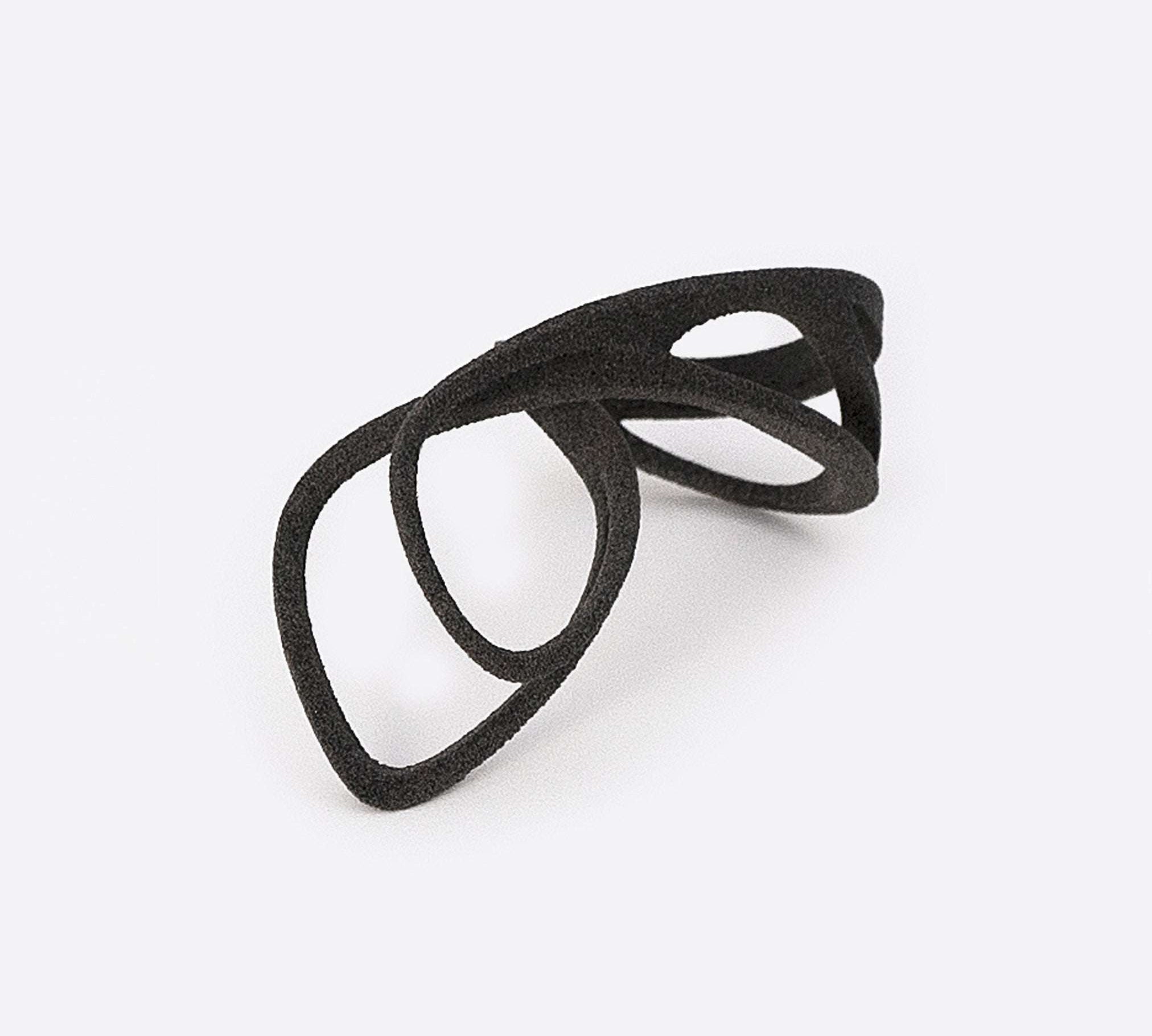 Gray nylon Mobius Sample Ring with elliptical petal design, lightweight and flexible.
