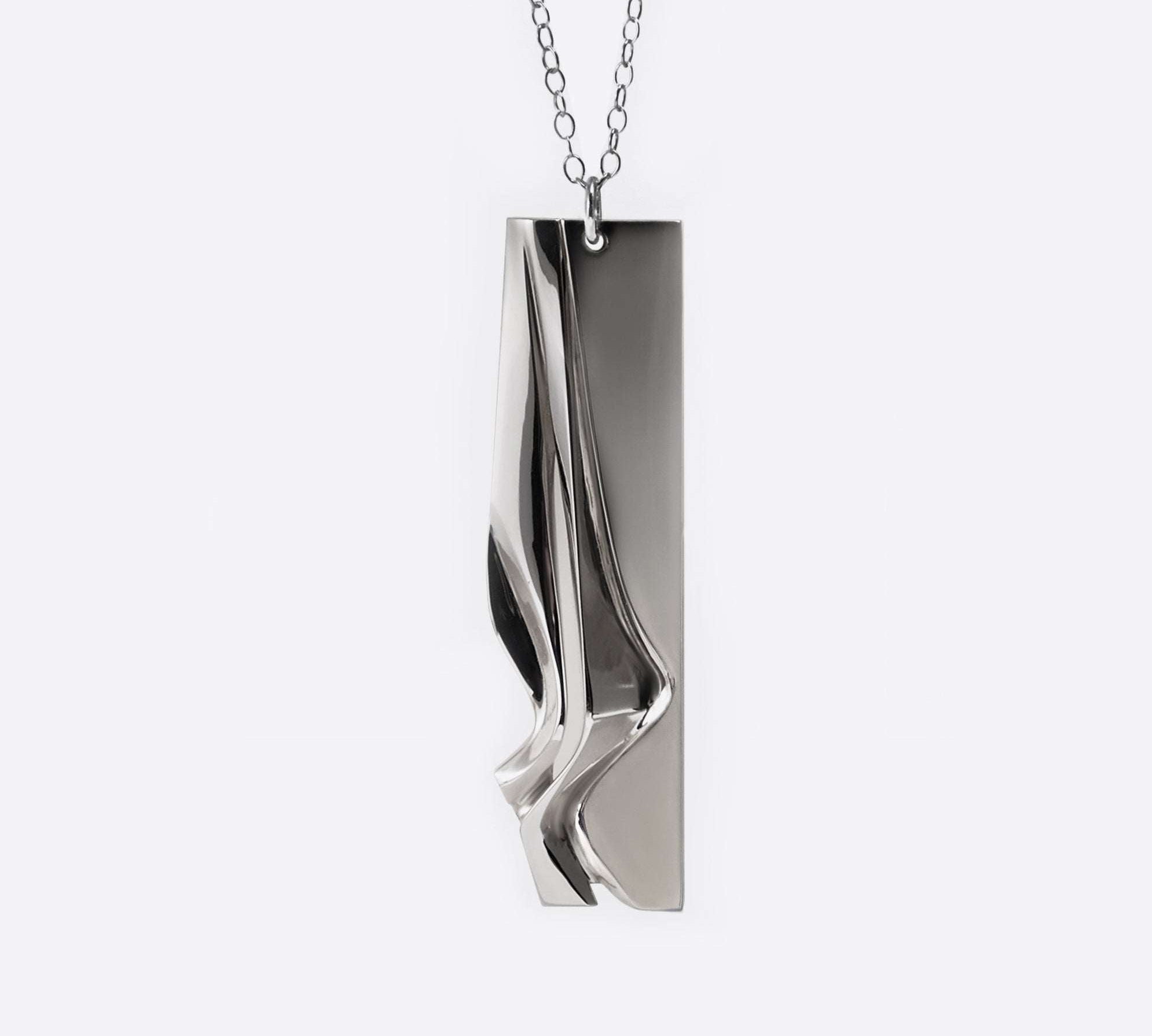 Nocturne Pendant sterling silver necklace with twisting, stacked curves and mirror finish