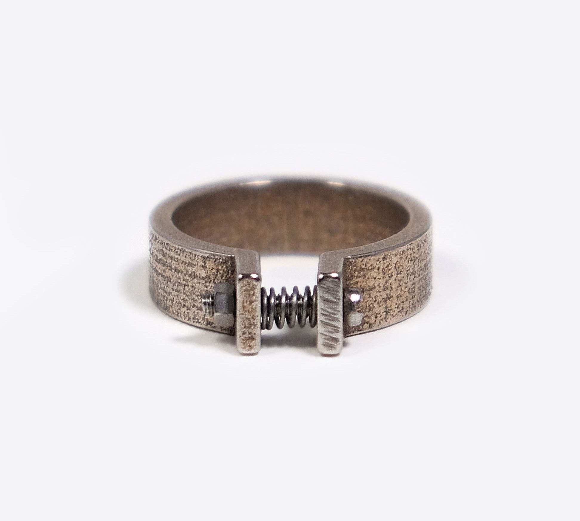 Machina Q 3D printed adjustable men's ring in stainless steel with mechanistic hardware and industrial design