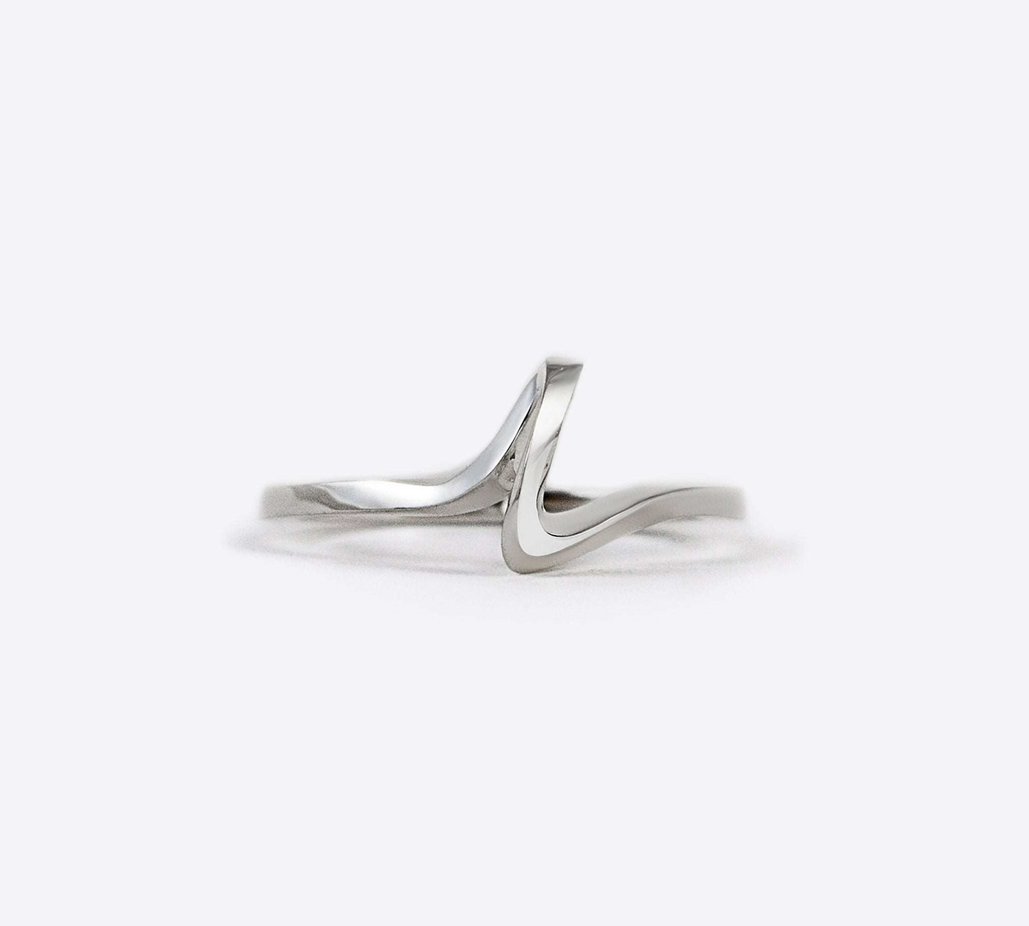 Sterling silver Sera Ring with a delicate twisted knot design on a white background