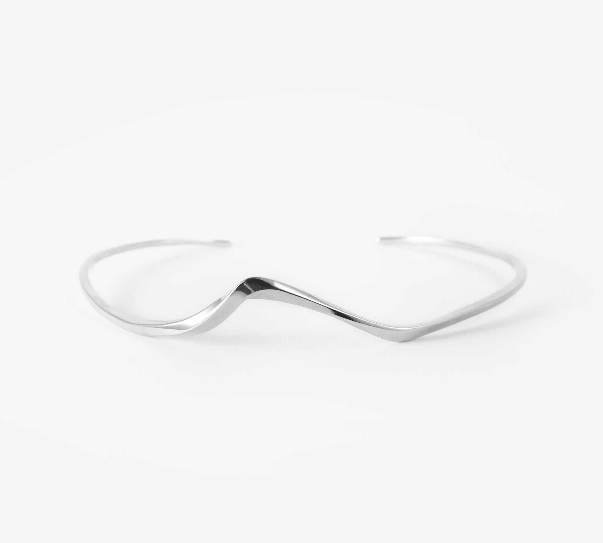 Minimalist sterling silver Interlude Choker with precision edge detailing and organic flow design, adjustable fit.