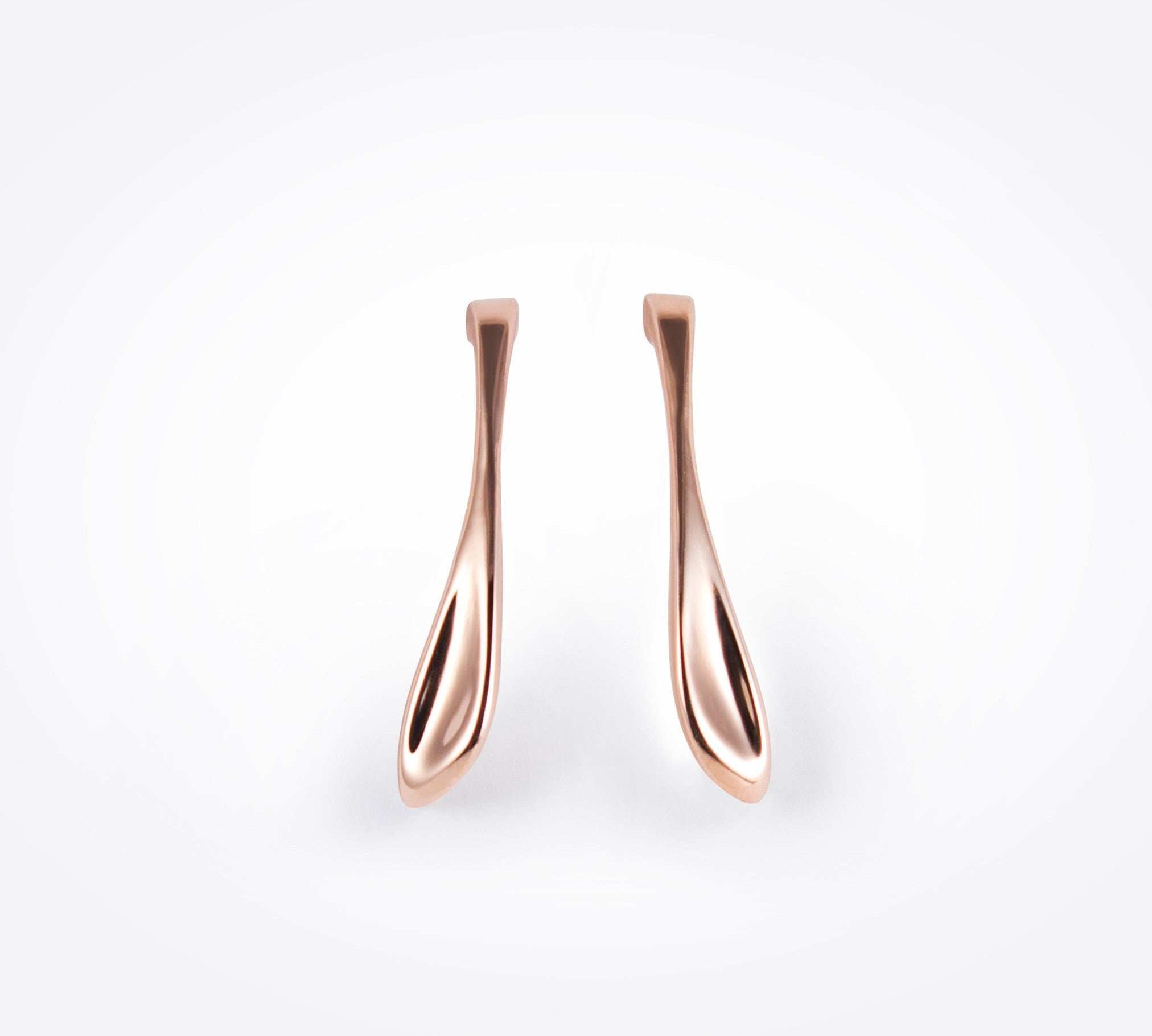 Rose gold Lini earrings with a curved drop shape inspired by a dew drop, available in bold 2-inch length.