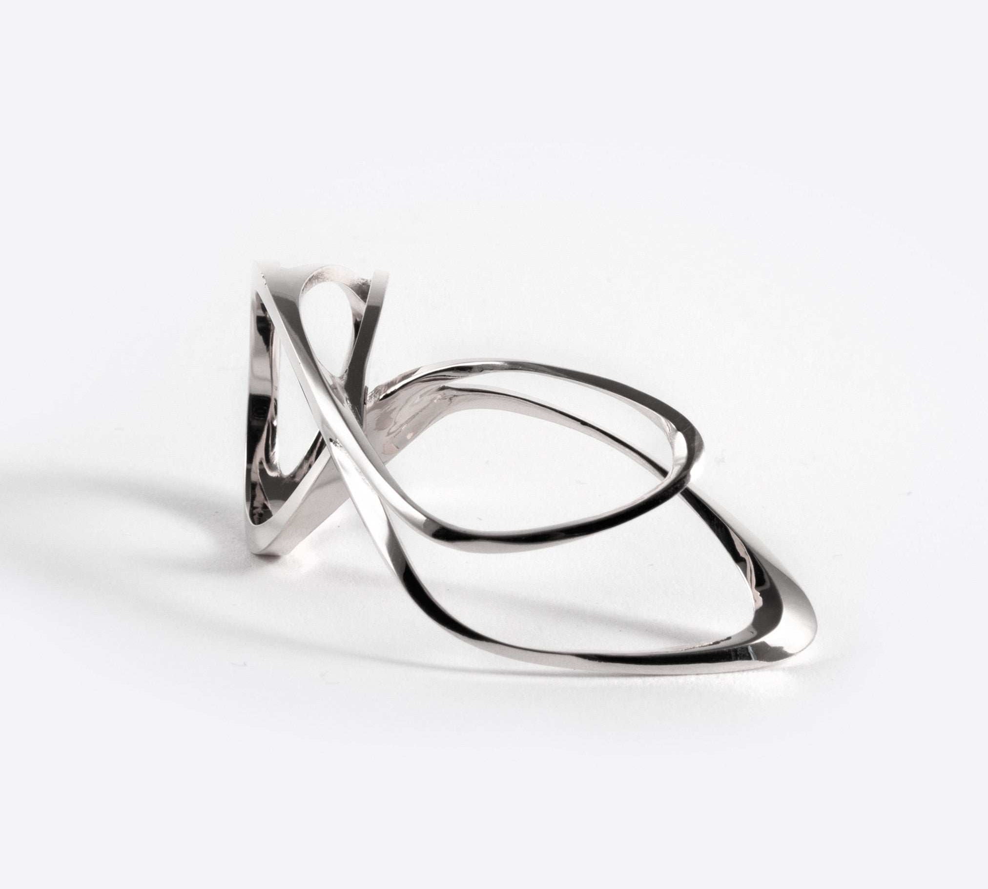 Sterling silver Mobius ring with fluid single-line design forming an elliptical petal shape.