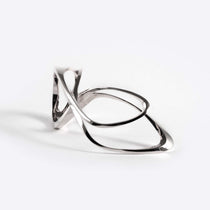 Sterling silver Mobius ring with fluid single-line design forming an elliptical petal shape.