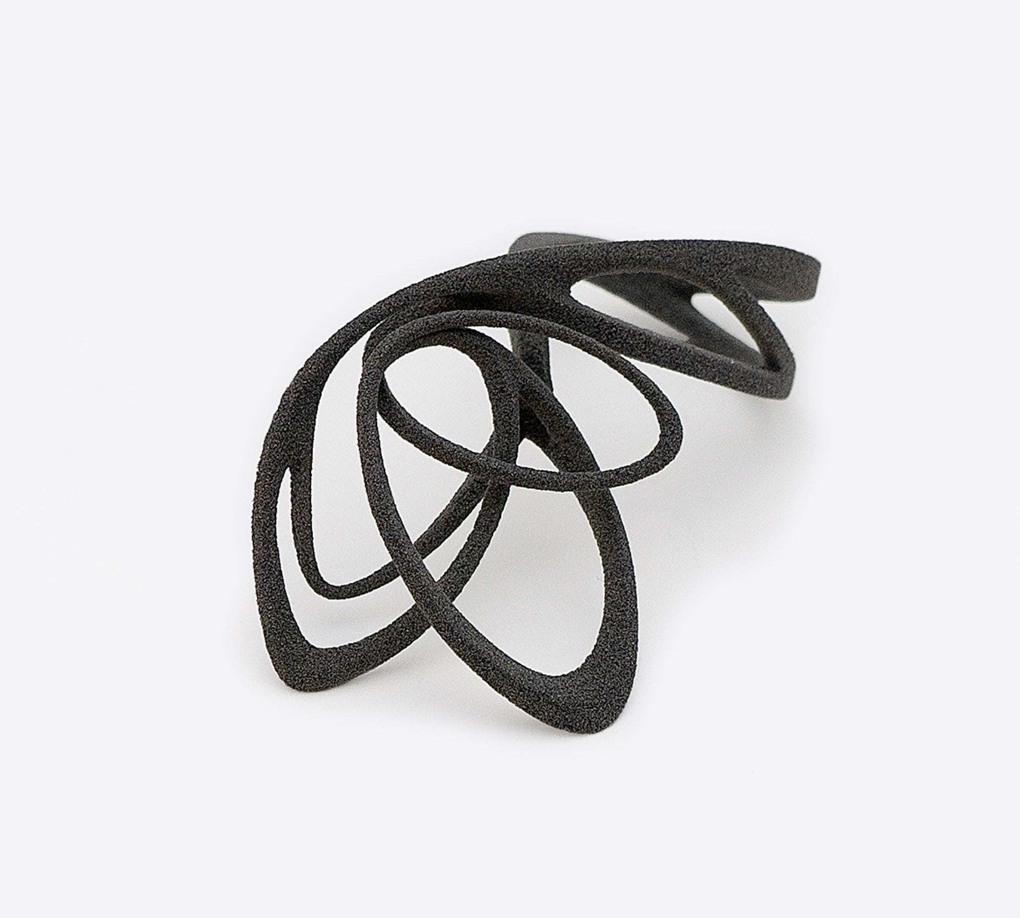 Gray nylon Papilio sample ring with elliptical petal design and intricate edges