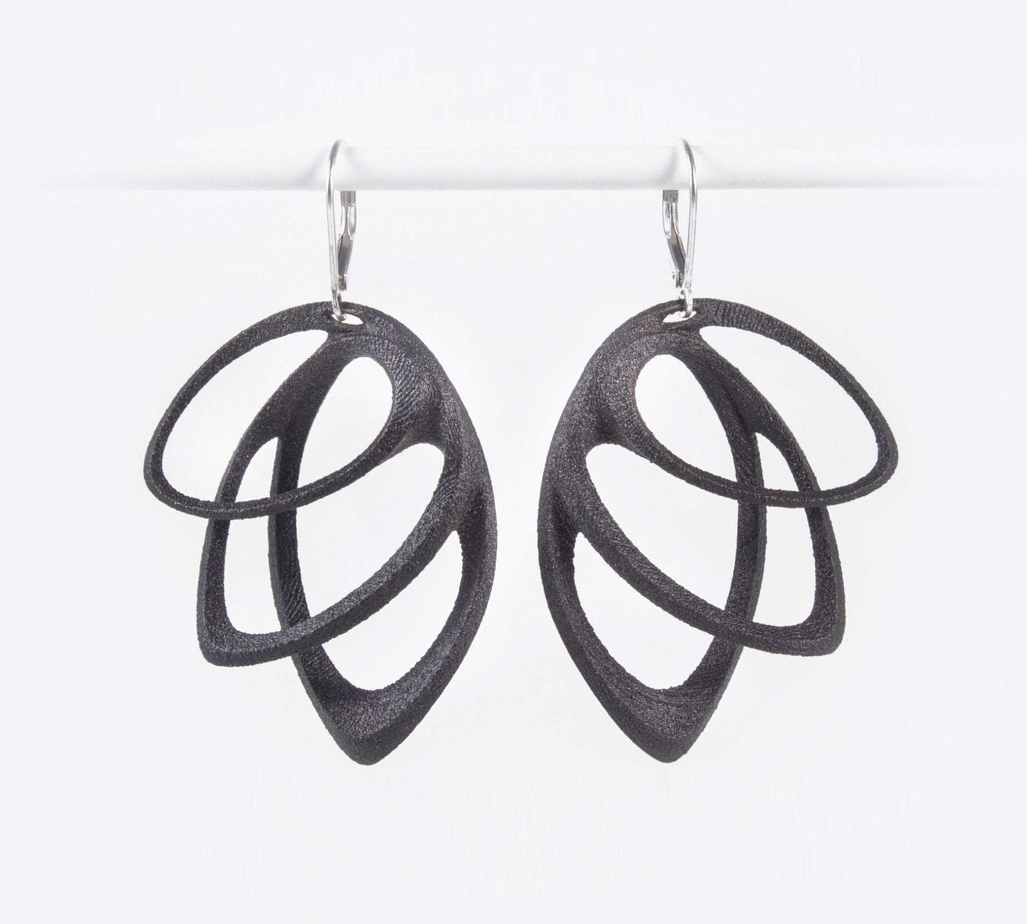 Orbis Steel Earrings in black with three elliptical petals and custom felt pouch